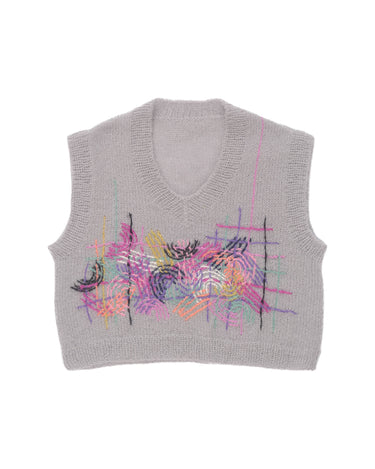 Grey mohair vest laid flat on white background. The vest is adorned with colourful embroidered abstract motifs in its center.